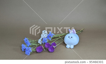 Cute stuffed rabbit and dried flowers Cute stuffed rabbit and dried flowers 95466301