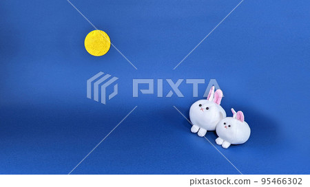 Two cute stuffed rabbits and the moon Two cute stuffed rabbits and the moon 95466302