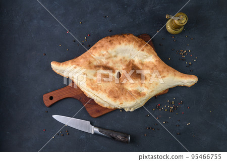 Georgian bread lavash on wooden board on dark rustic background, top view 95466755