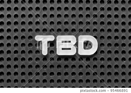 White alphabet letter in word TBD (Abbreviation of to be defined, discussed, determined, decided, deleted or declared) on black pegboard background 95466891