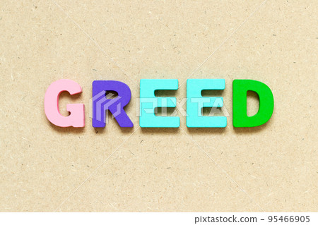 Color alphabet letter with word greed on wood background 95466905