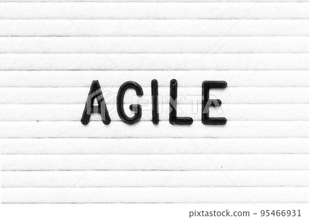 Black color letter in word agile on white felt board background 95466931