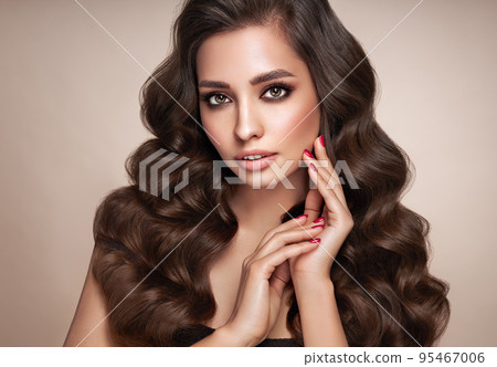 Smiling beautiful woman with long curly hair Smiling beautiful woman with long curly hair 95467006