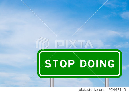 Green color transportation sign with word stop doing on blue sky with white cloud background Green color transportation sign with word stop doing on blue sky with white cloud background 95467143