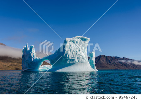 Beautiful landscape with iceberg in Greenland at summer time. Sunny weather. Beautiful landscape with iceberg in Greenland at summer time. Sunny weather. 95467243
