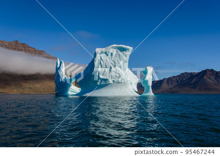 Beautiful landscape with iceberg in Greenland at summer time. Sunny weather. Beautiful landscape with iceberg in Greenland at summer time. Sunny weather. 95467244
