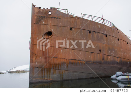 Old rusty wreck in Antarctic sea Old rusty wreck in Antarctic sea 95467723