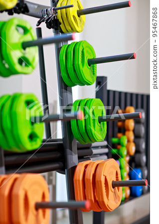 stand for barbell discs and dumbbells for the gym. stand for barbell discs and dumbbells for the gym. 95467868