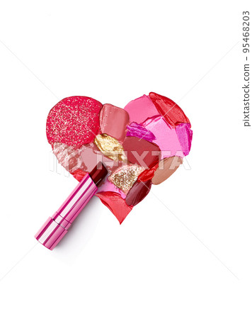 Pink lipstick smeared in the shape of heart 95468203