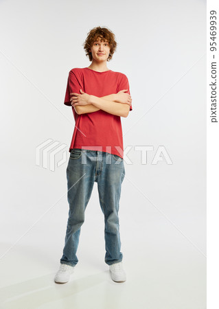 Shyness young man standing with crossed arms isolated over white background. Youth emotions, youth, sales, ad 95469939