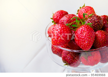 Glass bowl with fresh ripe strawberries, space for text, copy space, white background, mockup Glass bowl with fresh ripe strawberries, space for text, copy space, white background, mockup 95469988