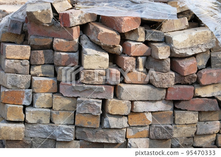 Building materials for construction of sidewalk. Construction of sidewalks. Paving tiles at construction site. Building materials for construction of sidewalk. Construction of sidewalks. Paving tiles at construction site. 95470333