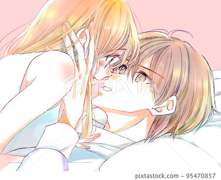 Male and female couple playing in bed, holding hands 95470857