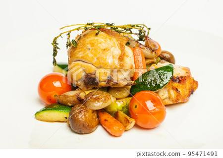 Roasted chicken with potatoes and tomatoes on white background Roasted chicken with potatoes and tomatoes on white background 95471491
