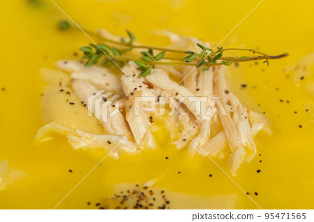 Homemade fresh creamy soup with chicken, vegetables close up Homemade fresh creamy soup with chicken, vegetables close up 95471565