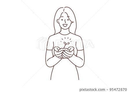 Smiling woman with seedling in hands  95472870