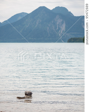 Lakeside Walchensee, upper Bavaria. Stacked stones stinking up Lakeside Walchensee, upper Bavaria. Stacked stones stinking up 95472889