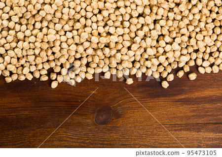 Raw cheakpea background on wooden surface, nutritious food Raw cheakpea background on wooden surface, nutritious food 95473105