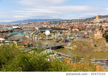 Beautiful view of Kura river and Bridge of Peace in Tbilisi 95473143
