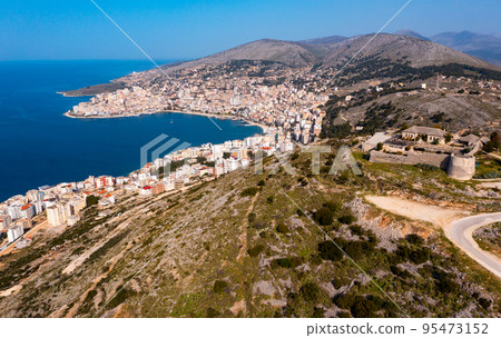 Aerial view of Sarande cityscape on Ionian Sea with Lekuresi Castle Aerial view of Sarande cityscape on Ionian Sea with Lekuresi Castle 95473152