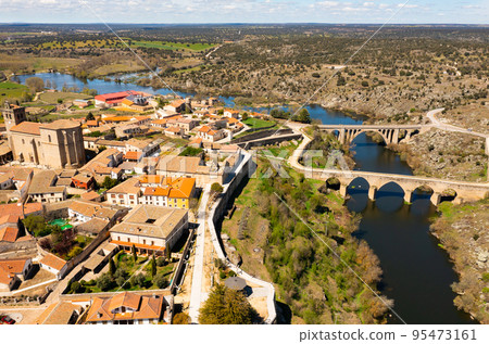 Drone view of historic center of Ledesma on banks of Tormes river Drone view of historic center of Ledesma on banks of Tormes river 95473161