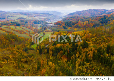Autumn landscape with winding road Autumn landscape with winding road 95473219