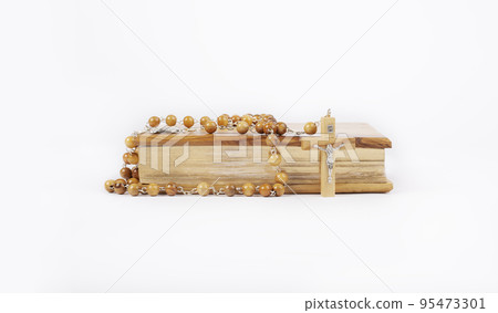Wooden Bible from Jerusalem with rosary isolated on white background 95473301