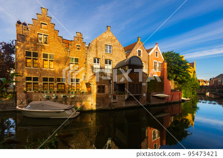 Typical residential buildings in historic center of Ghent along Leie river 95473421