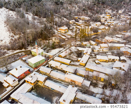 Typical Turkish mountainous village of Muratdere covered with snow 95473821