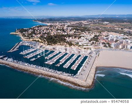 Aerial view of Torredembarra with port 95474058