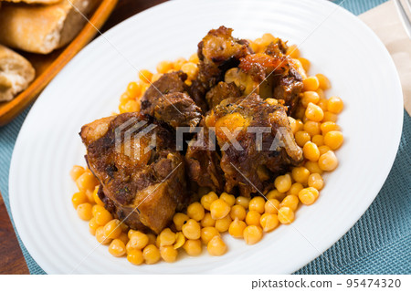Oxtail stew with chickpeas - traditional Spanish dish Oxtail stew with chickpeas - traditional Spanish dish 95474320