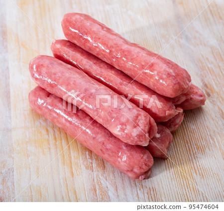 Raw sausages llonganissa 95474604