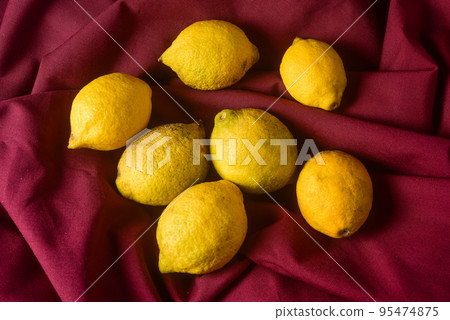 Organic lemons, harvested from the garden, prepared on the table. 95474875