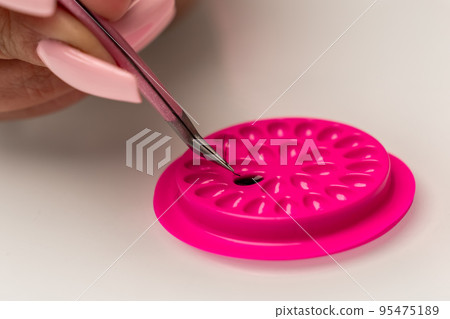 Eyelash extension tools. Fake eyelashes. Accessories for eyelash extensions. Drop of eyelash glue and curve tweezers. Eyelash extension procedure. Eyelash extension tools. Fake eyelashes. Accessories for eyelash extensions. Drop of eyelash glue and curve tweezers. Eyelash extension procedure. 95475189