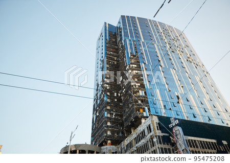 Kyiv, Ukraine - October 16, 2022: A business center building was hit by Russian shelling in Kyiv, Ukraine. After several months of relative calm, multiple explosions rocked Kyiv early Monday morning Kyiv, Ukraine - October 16, 2022: A business center building was hit by Russian shelling in Kyiv, Ukraine. After several months of relative calm, multiple explosions rocked Kyiv early Monday morning 95475208