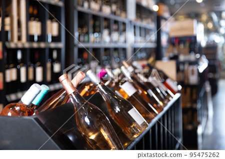 Red wine bottles waiting for customers Red wine bottles waiting for customers 95475262