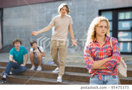 Sad girl quarreled with boys Sad girl quarreled with boys 95475373