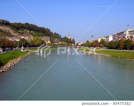 Salzburg, embankment of the Salzach river, view of the city from afar. Austria 95475382