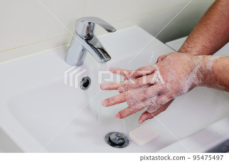 Hygiene and prevention of infection. Washing hands rubbing with soap man for corona virus prevention. Cleaning to stop spreading covid-19. Hygiene and prevention of infection. Washing hands rubbing with soap man for corona virus prevention. Cleaning to stop spreading covid-19. 95475497