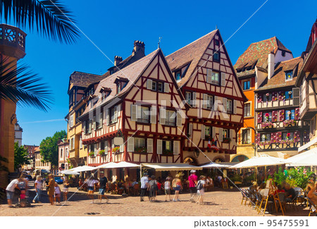 Historic center of Colmar with paved streets and half-timbered houses, France 95475591