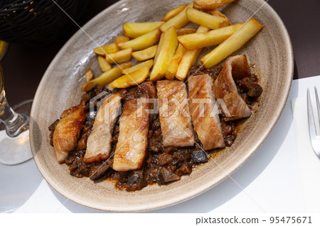 Spanish secreto iberico - iberian pork in sweet wine with stewed vegetables Spanish secreto iberico - iberian pork in sweet wine with stewed vegetables 95475671