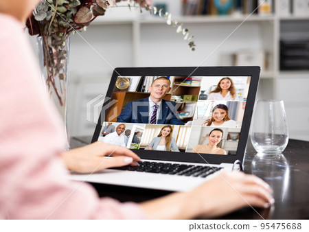 Manager holding online meeting on laptop Manager holding online meeting on laptop 95475688
