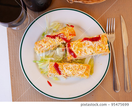 Pastel de verano - delicious summer cake with sliced bread, ham, cheese, surimi, mayonnaise Pastel de verano - delicious summer cake with sliced bread, ham, cheese, surimi, mayonnaise 95475699