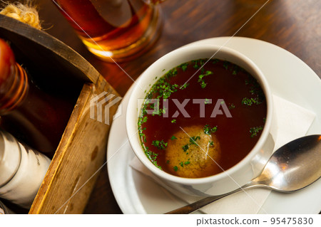 Homemade beef soup with liver dumplings Homemade beef soup with liver dumplings 95475830