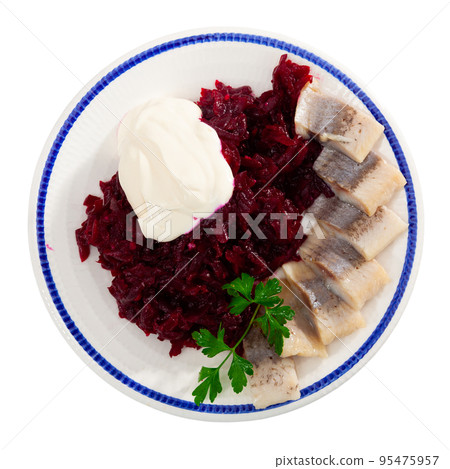 Appetizing herring salad with beets, sour cream and parsley in white plate 95475957