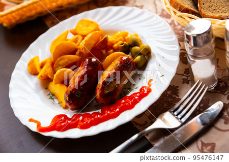 Tasty krill sausages with olives and corn Tasty krill sausages with olives and corn 95476147