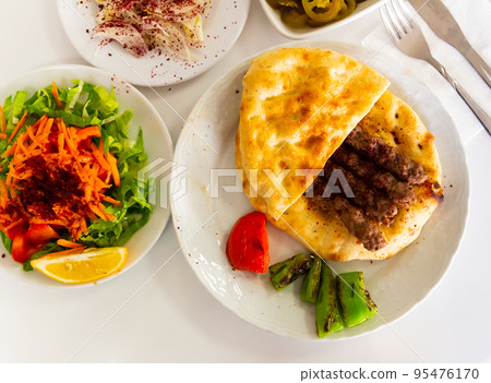 A traditional Turkish dish called Shish Kefte (Isparta sis Kofte). A traditional Turkish dish called Shish Kefte (Isparta sis Kofte). 95476170