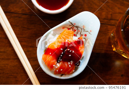 Chirashi salmon and rice bowl. Chirashi salmon and rice bowl. 95476191