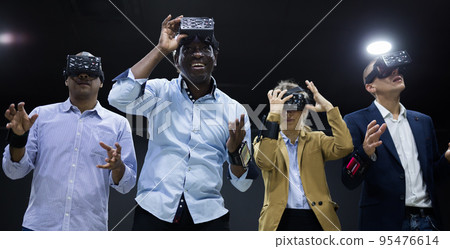 People using virtual reality headset and gesturing 95476614