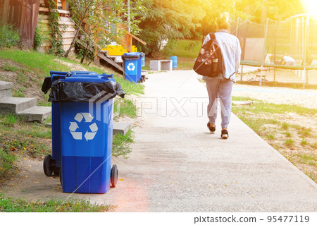 Waste recycling concept. Blue containers for further processing of garbage. Garbage collection, sign ecology. Sunshine. Waste recycling concept. Blue containers for further processing of garbage. Garbage collection, sign ecology. Sunshine. 95477119